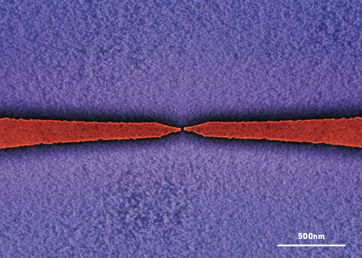COLOUR-ENHANCED SEM IMAGE OF A NANOSCALE GAP IN A METAL ELECTRODE PAIR WITH STRONG ELECTRON TRANSPORT.