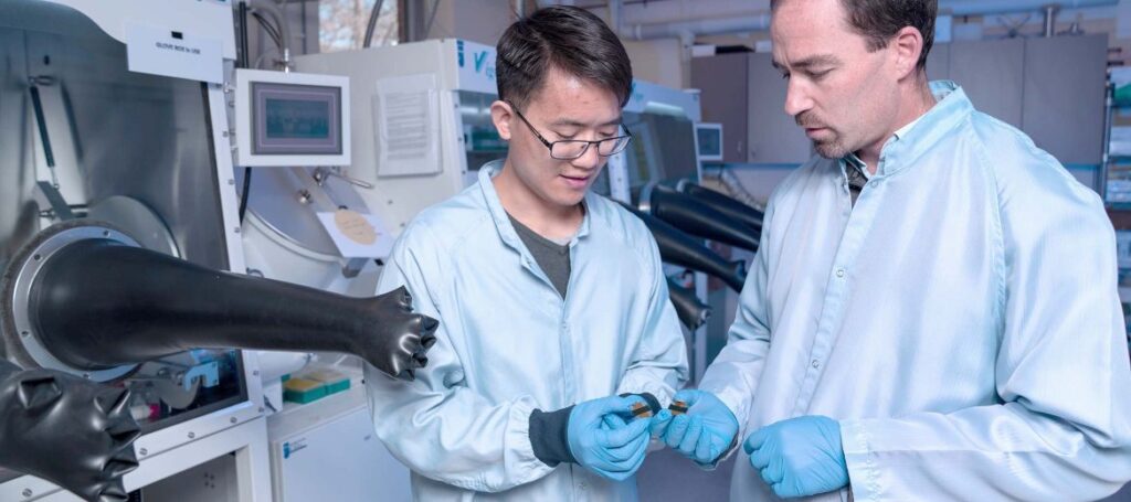 DR JUN PENG AND A/PROF. TOM WHITE FROM THE ANU WITH THEIR RECORD BREAKING PEROVSKITE SOLAR CELLS (LANNON HARLEY/ANU).